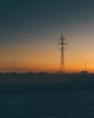 Power line support during sunrise