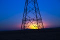 Power line tower and sunrise Royalty Free Stock Photo