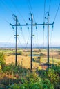 Power line with a view over the fields with autumn colors Royalty Free Stock Photo