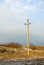 Power line in winter dune of Curonian spit Royalty Free Stock Photo