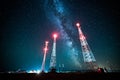 Power lines against night sky and milky way galaxy Royalty Free Stock Photo