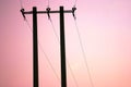 Power lines against sunset sky Royalty Free Stock Photo