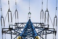 Power lines on background of blue sky close-up. Electricity equipment with copy space. Wires of high voltage in sky. Royalty Free Stock Photo