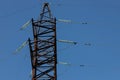 Power lines on background of blue sky close-up. Electric hub on pole. Electricity equipment with copy space. Wires of Royalty Free Stock Photo