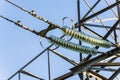 Power lines on background of blue sky close-up. Electricity equipment with copy space. Wires of high voltage in sky. Royalty Free Stock Photo