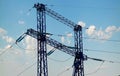 Power lines on background of blue sky close-up. Silhouette of electric pole with copy space. Royalty Free Stock Photo