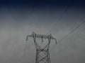 Power lines in the city. Electric cables attached to a street power pole under blue sky. Royalty Free Stock Photo