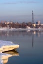 Power lines and the city are reflected in the river - vertical Royalty Free Stock Photo