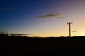 Power lines by a country road Royalty Free Stock Photo