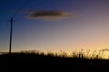 Power lines by a country road Royalty Free Stock Photo