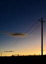 Power lines by a country road Royalty Free Stock Photo