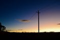 Power lines by a country road Royalty Free Stock Photo