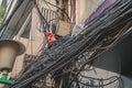 Power lines electric cables in the city streets of Hanoi, Vietnam Royalty Free Stock Photo