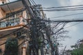 Power lines electric cables in the city streets of Hanoi, Vietnam Royalty Free Stock Photo