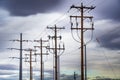 Power lines hang from wooden power poles