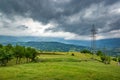 Power lines in the mountains. Cloudy day Royalty Free Stock Photo