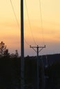 Power lines reflection evening sun in Swedish winter Royalty Free Stock Photo