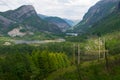 Power Lines running over rural mountains in Europe (Norway), with fjords in background - Green Future concept Royalty Free Stock Photo