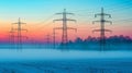 Power lines silhouette against vibrant blue and pink sunset sky, creating a dramatic scene. Royalty Free Stock Photo