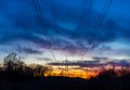 Power lines silhouette at sunset Royalty Free Stock Photo