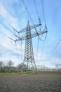 Power lines and substation, high voltage lines behind, electrical grid. High-voltage power line, transmission tower overhead line Royalty Free Stock Photo