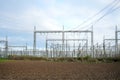 Power lines and substation, high voltage lines behind, electrical grid. High-voltage power line, transmission tower overhead line Royalty Free Stock Photo