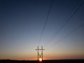 Power lines at the sunset