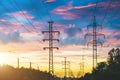 Power lines, sunset evening sky and perspective street in the city. Royalty Free Stock Photo