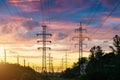 Power lines, sunset evening sky and perspective street in the city. Royalty Free Stock Photo