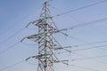 Power lines and towers - a modern high voltage power system. Against the background of the blue sky Royalty Free Stock Photo