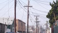 Power lines or wires on poles California city street, USA. Electricity supply.