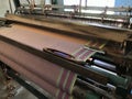 Power loom equipment weaving sarees by using wefts and plaiting using thousands of warps and this weaving industry running in