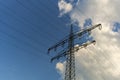 A power mast below a blue sky Royalty Free Stock Photo