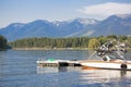 Power motor boat parked at a boat dock on a scenic mountain lake