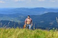 Power of Music. sexy man with guitar in checkered shirt. hipster fashion. western camping and hiking. happy and free