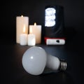 Power outage - the light bulb does not glow, flashlights and candles as sources of light and heat Royalty Free Stock Photo