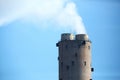 Power plant chimney with dense smokes Royalty Free Stock Photo