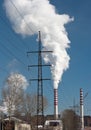 Power plant smoking stacks and tower Royalty Free Stock Photo