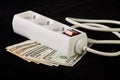 Power plug and money concept energy costs Royalty Free Stock Photo