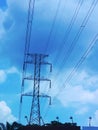 power pole and electrical wires against a blue sky Royalty Free Stock Photo