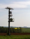 Power pole in the field, with Muenzenberg Castle in the background Royalty Free Stock Photo