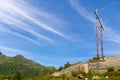 power pole and power lines leading over mountain landscape in the great outdoors Royalty Free Stock Photo