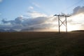 Power pole with sunset in Iceland. Light and shadow over the lan Royalty Free Stock Photo