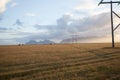 Power pole with sunset in Iceland. Light and shadow over the lan Royalty Free Stock Photo