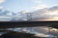 Power pole with sunset in Iceland. Light and shadow over the lan Royalty Free Stock Photo