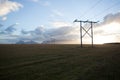 Power pole with sunset in Iceland. Light and shadow over the lan Royalty Free Stock Photo