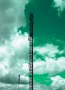 Power poles with lines under the green sky. Abstract color for mood and feeling
