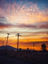 Power Poles Silhouetted Against a Beautiful Arizona Desert Sunrise. Royalty Free Stock Photo