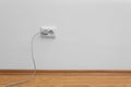 Power socket and plug on wall, space for text. Electrician`s equipment Royalty Free Stock Photo