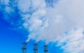 Smoke billowing from industrial smoke stacks. Royalty Free Stock Photo